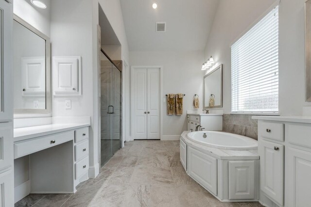 14303 Paseo Marbella Dr, Cypress, TX 77433 - bathroom featuring vaulted ceiling, a shower stall, a bath, vanity, and marble finish flooring