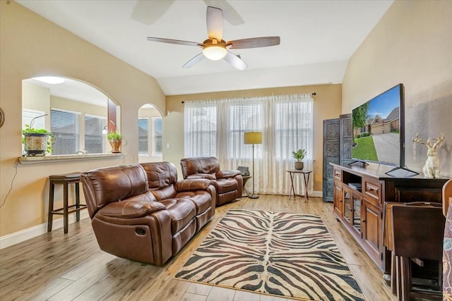8323 Egret Bay Cir, Baytown, TX 77523 - living room with a ceiling fan, light wood finished floors, vaulted ceiling, and baseboards