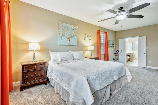 8323 Egret Bay Cir, Baytown, TX 77523 - bedroom featuring carpet, baseboards, ceiling fan, and ensuite bathroom
