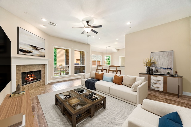 42 Brookefield Cir, Magnolia, TX 77355 - living area featuring a ceiling fan, a fireplace, wood finished floors, recessed lighting, and baseboards