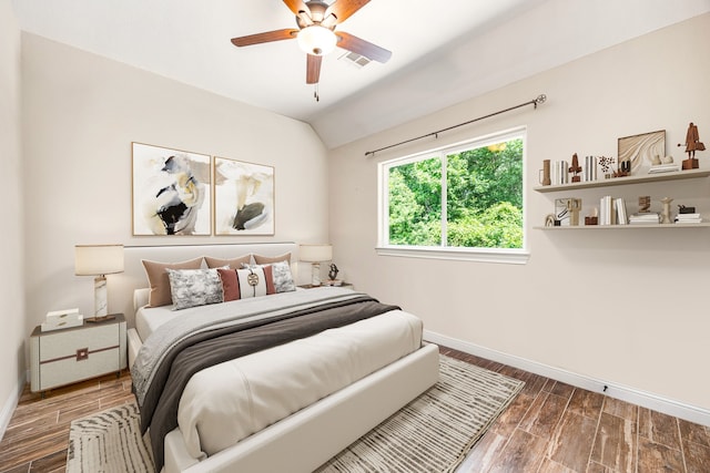 42 Brookefield Cir, Magnolia, TX 77355 - bedroom with baseboards, wood finished floors, vaulted ceiling, and a ceiling fan
