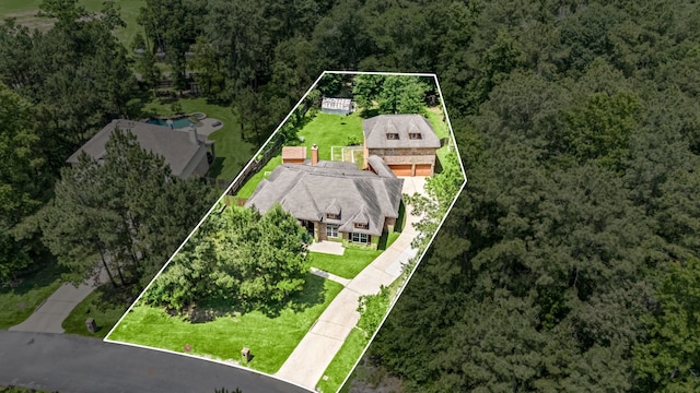 42 Brookefield Cir, Magnolia, TX 77355 - view of property location featuring property boundaries highlighted and a heavily wooded area