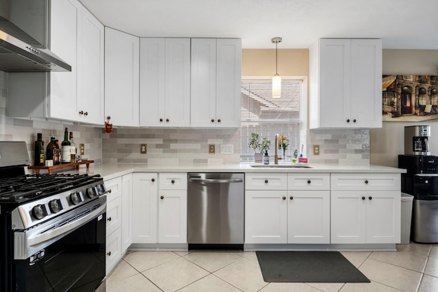 3315 Keygate Dr, Spring, TX 77388 - kitchen with stainless steel appliances, exhaust hood, a sink, and light countertops