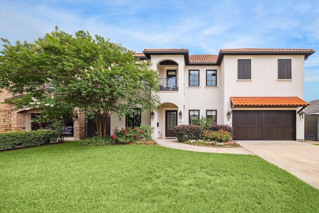1249 Gardenia Dr, Houston, TX 77018 - mediterranean / spanish-style house with a tile roof, a front lawn, driveway, a balcony, and stucco siding