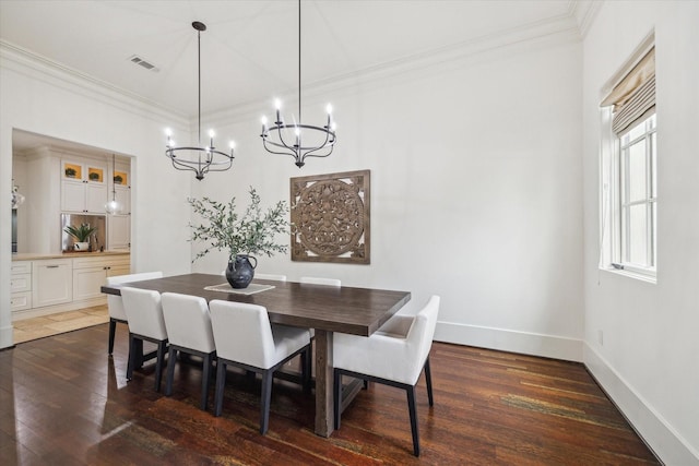 1249 Gardenia Dr, Houston, TX 77018 - dining room with a chandelier, ornamental molding, dark wood finished floors, and baseboards