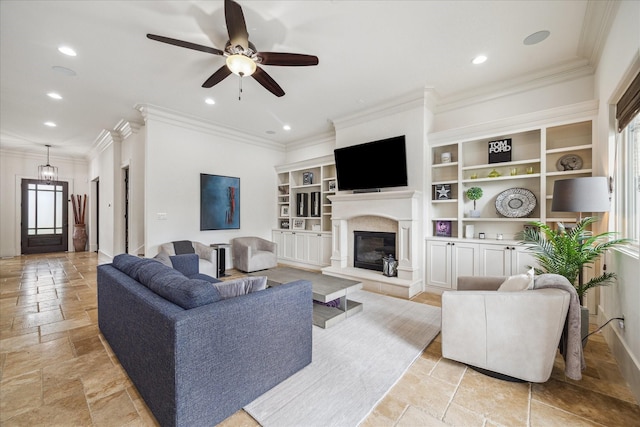 1249 Gardenia Dr, Houston, TX 77018 - living room featuring stone tile flooring, a glass covered fireplace, crown molding, plenty of natural light, and a ceiling fan