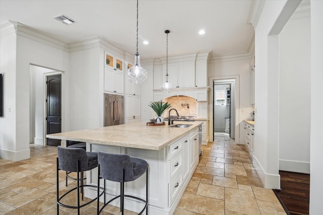 1249 Gardenia Dr, Houston, TX 77018 - kitchen with high quality fridge, stone tile floors, a sink, baseboards, and light stone countertops