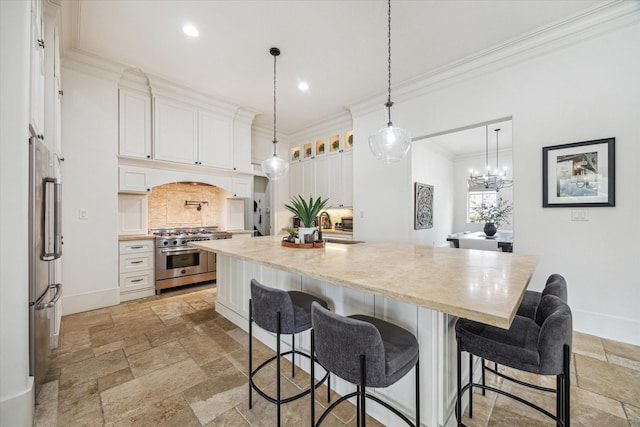 1249 Gardenia Dr, Houston, TX 77018 - kitchen with stainless steel appliances, stone tile floors, tasteful backsplash, crown molding, and white cabinetry
