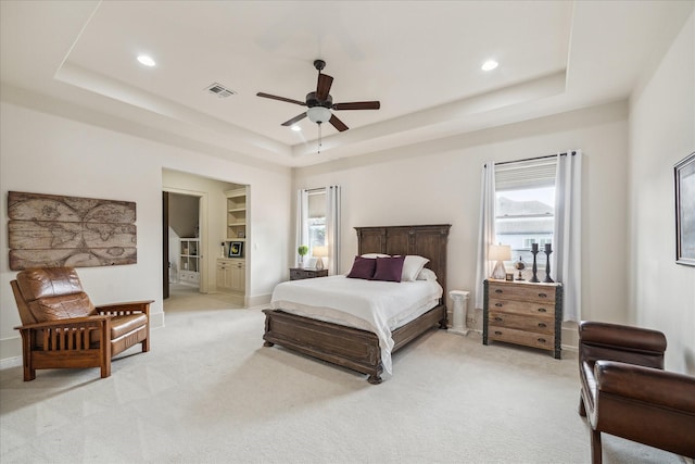 1249 Gardenia Dr, Houston, TX 77018 - bedroom featuring a raised ceiling, light colored carpet, recessed lighting, a ceiling fan, and baseboards