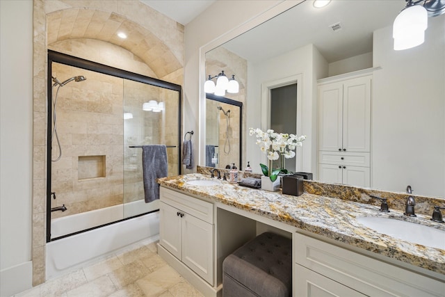 1249 Gardenia Dr, Houston, TX 77018 - bathroom featuring enclosed tub / shower combo, double vanity, and stone finish floors