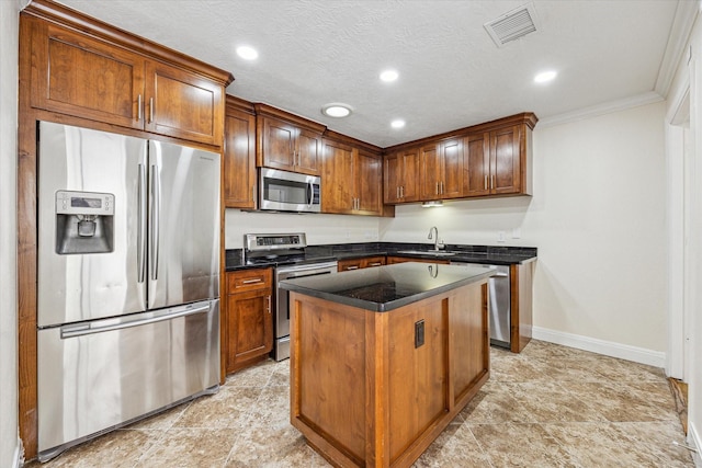 12124 Burdine St, Houston, TX 77035 - kitchen with appliances with stainless steel finishes, a sink, baseboards, a center island, and recessed lighting