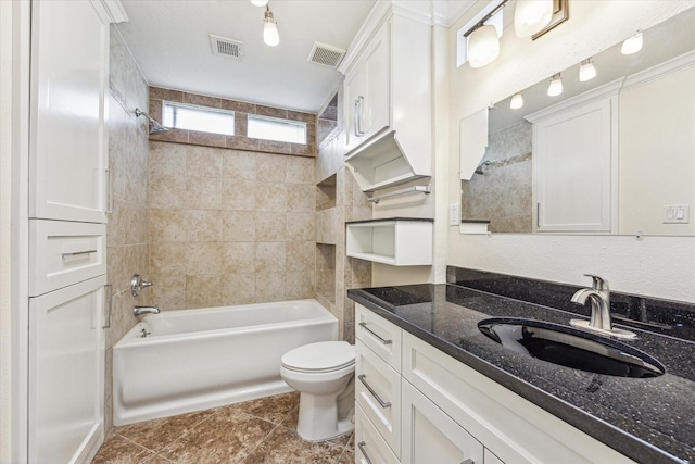 12124 Burdine St, Houston, TX 77035 - full bath with toilet,  shower combination, tile patterned flooring, and vanity