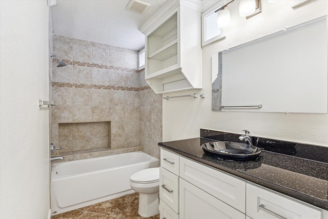 12124 Burdine St, Houston, TX 77035 - full bathroom with toilet, vanity, washtub / shower combination, and tile patterned floors
