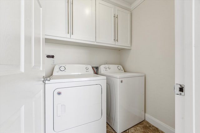 12124 Burdine St, Houston, TX 77035 - washroom featuring independent washer and dryer, cabinet space, and baseboards