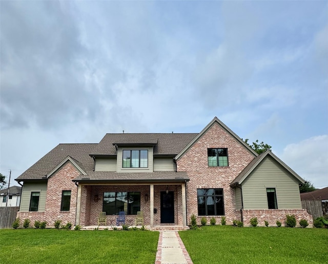 1701 Bayram Dr, Houston, TX 77055 - view of front of house featuring brick siding, roof with shingles, and a porch