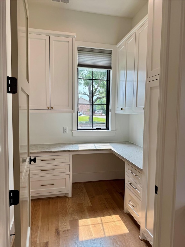 1701 Bayram Dr, Houston, TX 77055 - unfurnished office with built in study area and light wood finished floors