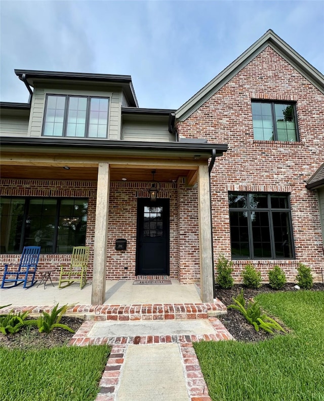 1701 Bayram Dr, Houston, TX 77055 - property entrance with covered porch and brick siding