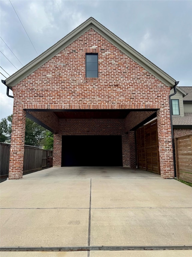 1701 Bayram Dr, Houston, TX 77055 - view of side of home featuring concrete driveway, a garage, and brick siding