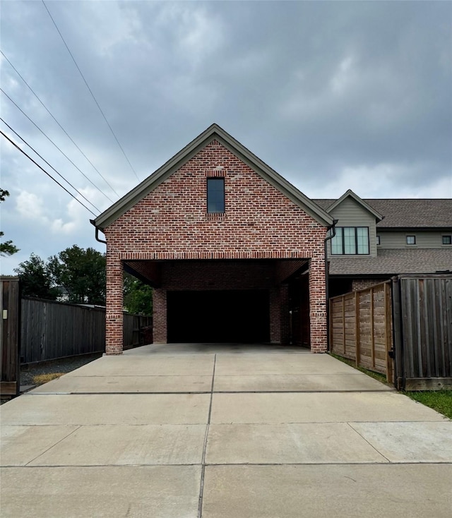 1701 Bayram Dr, Houston, TX 77055 - view of side of property with brick siding, a garage, and driveway