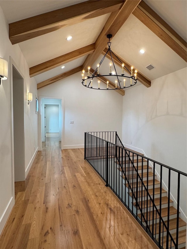 1701 Bayram Dr, Houston, TX 77055 - hallway with a chandelier, wood finished floors, baseboards, recessed lighting, and an upstairs landing