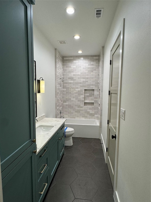 1701 Bayram Dr, Houston, TX 77055 - bathroom featuring toilet, vanity, recessed lighting, tile patterned floors, and shower / washtub combination
