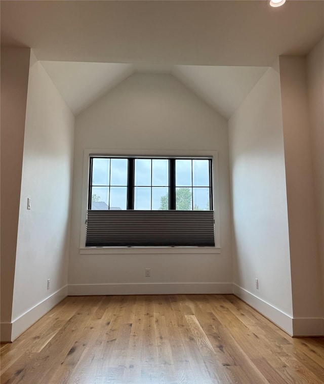 1701 Bayram Dr, Houston, TX 77055 - unfurnished room featuring light wood finished floors, baseboards, lofted ceiling, and recessed lighting