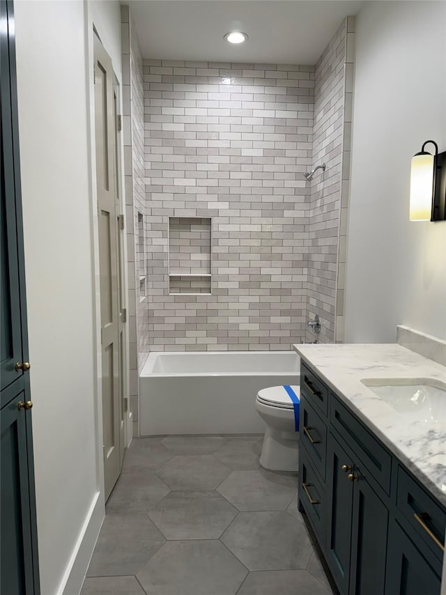 1701 Bayram Dr, Houston, TX 77055 - full bath featuring vanity, toilet,  shower combination, and recessed lighting