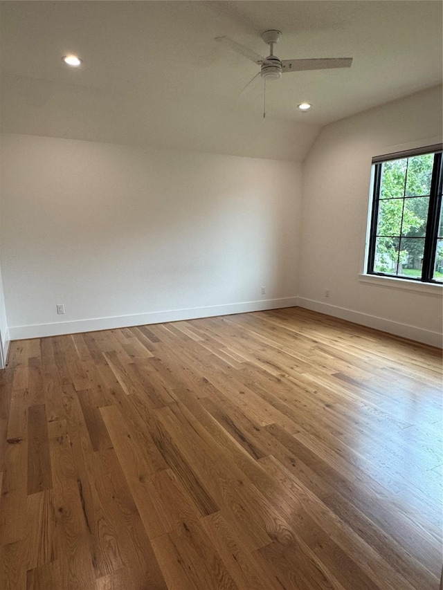 1701 Bayram Dr, Houston, TX 77055 - unfurnished room featuring wood finished floors, baseboards, ceiling fan, recessed lighting, and lofted ceiling