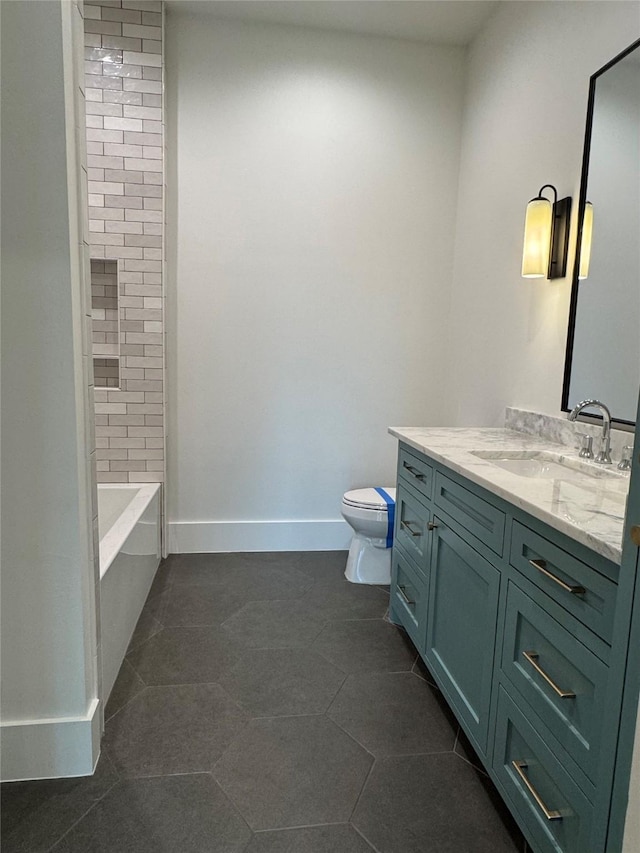 1701 Bayram Dr, Houston, TX 77055 - bathroom with toilet, vanity, tile patterned flooring, baseboards, and bathtub / shower combination
