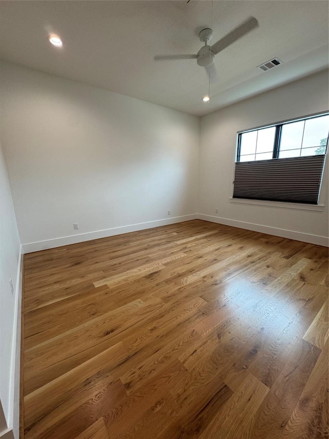 1701 Bayram Dr, Houston, TX 77055 - unfurnished room featuring wood finished floors, a ceiling fan, baseboards, and recessed lighting
