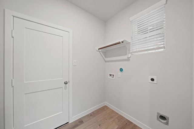 758 Westpointe Dr, Dayton, TX 77535 - laundry room featuring hookup for an electric dryer, light wood finished floors, washer hookup, and baseboards