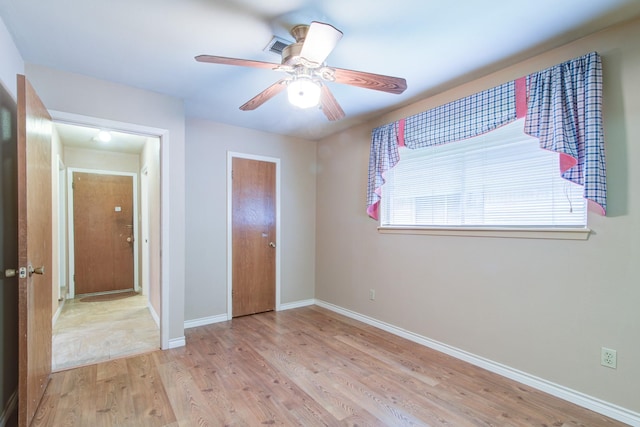 1708 Capstan Rd, Houston, TX 77062 - unfurnished bedroom featuring light wood-style flooring, baseboards, ceiling fan, and a closet