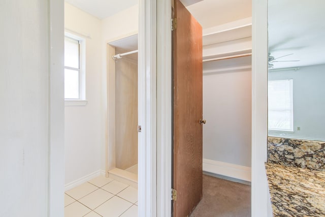 1708 Capstan Rd, Houston, TX 77062 - bathroom featuring healthy amount of natural light, a shower, tile patterned flooring, and ceiling fan