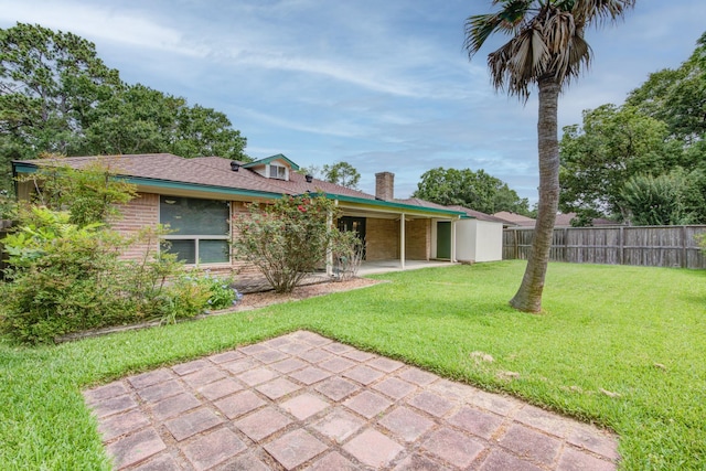 1708 Capstan Rd, Houston, TX 77062 - view of front of home with a patio area, a chimney, and brick siding