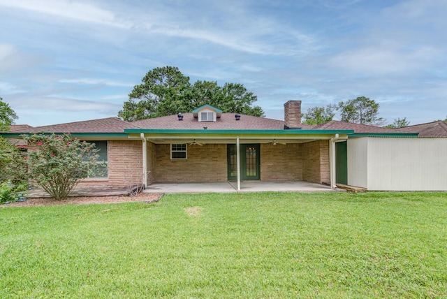 1708 Capstan Rd, Houston, TX 77062 - rear view of property featuring a chimney, a patio, a yard, ceiling fan, and brick siding