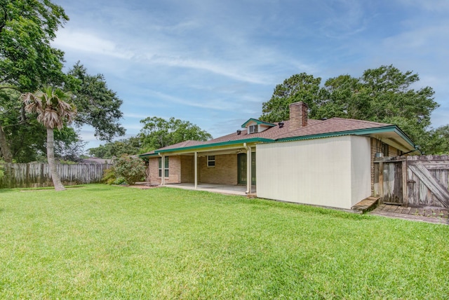 1708 Capstan Rd, Houston, TX 77062 - back of house with a patio area and a chimney