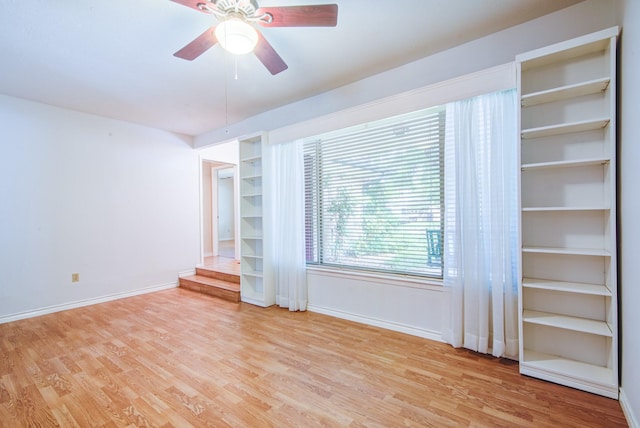 1708 Capstan Rd, Houston, TX 77062 - unfurnished room with wood finished floors, baseboards, and ceiling fan