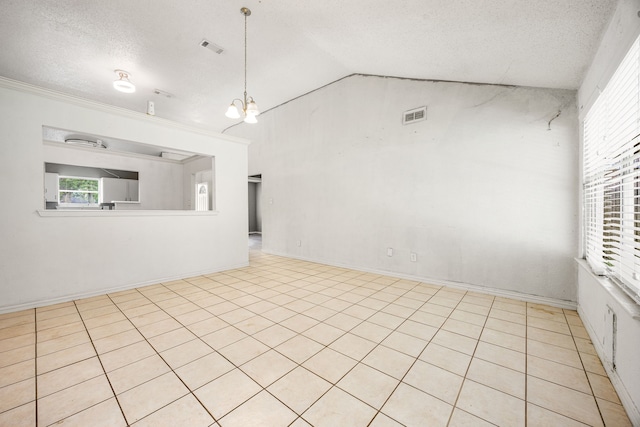 18627 Spinney Lane Dr, Cypress, TX 77433 - unfurnished room with vaulted ceiling, a textured ceiling, a chandelier, and crown molding