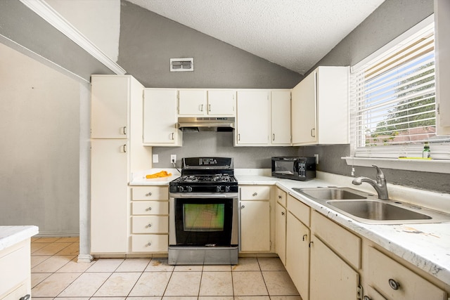 18627 Spinney Lane Dr, Cypress, TX 77433 - kitchen with stainless steel range with gas stovetop, under cabinet range hood, a sink, black microwave, and light countertops