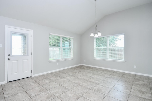 11819 Eagle Ridge Dr, Mont Belvieu, TX 77535 - entryway with healthy amount of natural light, a chandelier, vaulted ceiling, light tile patterned floors, and baseboards