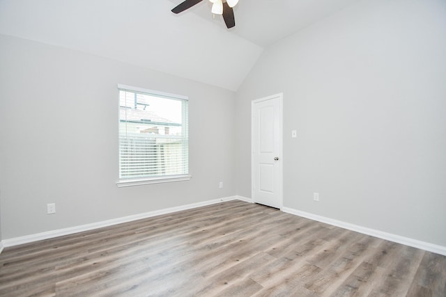 11819 Eagle Ridge Dr, Mont Belvieu, TX 77535 - unfurnished room with a ceiling fan, wood finished floors, lofted ceiling, and baseboards
