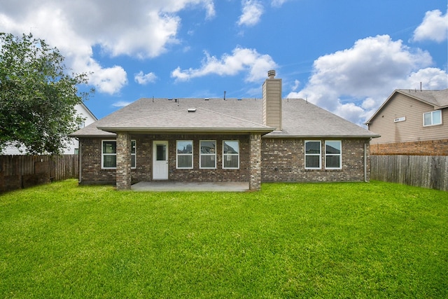 11819 Eagle Ridge Dr, Mont Belvieu, TX 77535 - back of property featuring a patio area, a chimney, brick siding, and roof with shingles