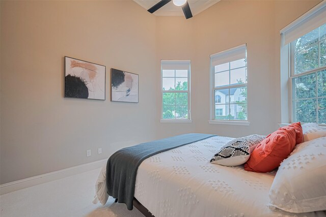 442 Imperial Blvd, Sugar Land, TX 77498 - carpeted bedroom with multiple windows and a ceiling fan