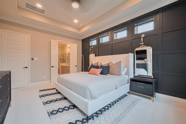442 Imperial Blvd, Sugar Land, TX 77498 - bedroom featuring multiple windows, recessed lighting, ensuite bath, a tray ceiling, and baseboards