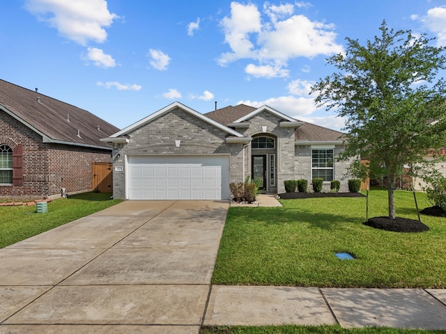 2525 Galley Ridge Dr, La Marque, TX 77568 - view of front facade featuring an attached garage, driveway, a front yard, and brick siding
