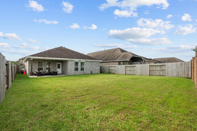 2525 Galley Ridge Dr, La Marque, TX 77568 - back of property featuring an outdoor living space and a patio area