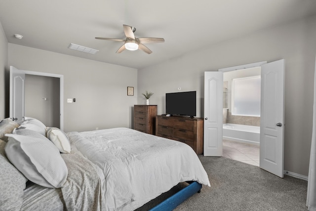 2525 Galley Ridge Dr, La Marque, TX 77568 - carpeted bedroom with a ceiling fan, ensuite bath, and tile patterned floors