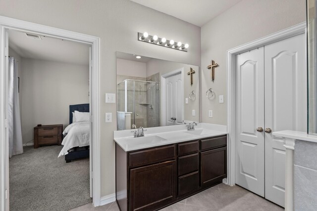 2525 Galley Ridge Dr, La Marque, TX 77568 - full bathroom with a shower stall, double vanity, and connected bathroom