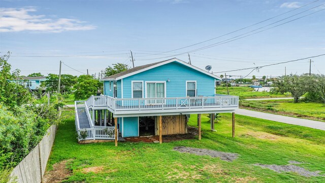 1004 20th St, Dickinson, TX 77539 - back of property with a deck, driveway, and stairs