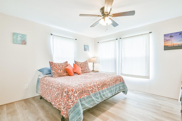 1004 20th St, Dickinson, TX 77539 - bedroom featuring wood finished floors and a ceiling fan